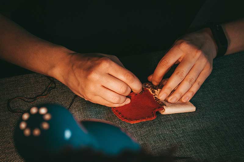 Jose MIer creating coin bag by hand